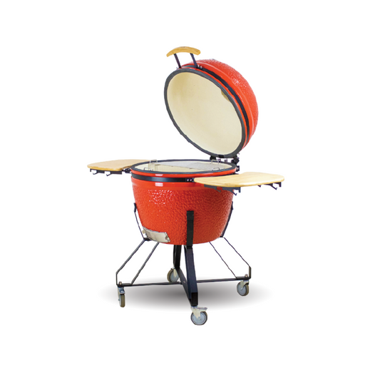 Red ceramic barbecue grill with open lid on a white background